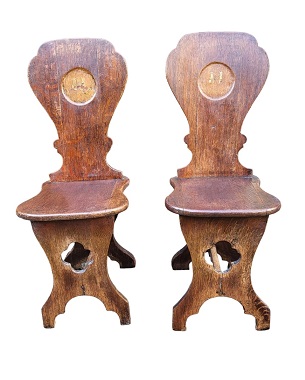 A    pair of Georgian sgabello oak hall chairs